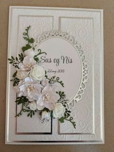 a wedding card with flowers on it