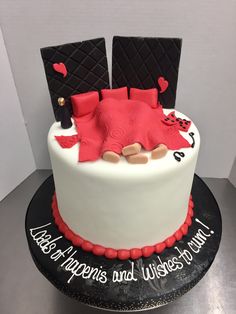 a cake decorated with red and black decorations