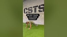 a man is doing push ups on the grass in front of a sign that says,