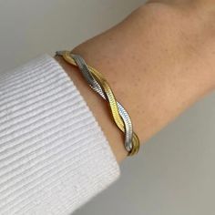 Our Eleanor Watchband Bracelet adds a trendy and timeless touch to any outfit. The perfect accessory for those looking to exude girl boss vibes. Made with high-quality materials for durability and style. Elevate your look and make a statement with this must-have piece. 316L Stainless Steel 18K PVD Gold Plated 6.5 inches long +2" inches ext/ 7mm wide Trendy Tarnish Resistant Bangle For Everyday, Modern Metal Braided Bracelet For Everyday, Modern Metal Braided Bracelets For Everyday, Modern Metal Braided Bracelet For Everyday Wear, Everyday Stainless Steel Braided Bracelet, Trendy Gold Braided Bracelets As Gift, Trendy Gold Braided Bracelets For Gift, Trendy Gold Braided Bracelets Perfect For Gifts, Trendy Metal Bangle For Everyday