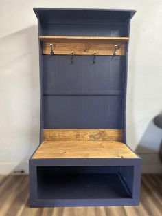 an empty bench with hooks on it in a room