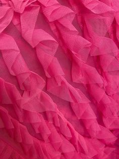 pink fabric with ruffles on it