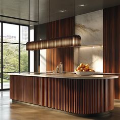 a large kitchen with wooden cabinets and marble counter tops