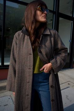 Oversized herringbone plaid coat has wide sleeves and buttons down front with side seam pockets and removable belt. fully lined.    100% wool outside / 100% rayon lining    measurements (laying flat):  xs / s   - chest: 22" shoulder to shoulder: 17" sleeve length: 22"  length (front) 45"  m / l   - chest: 23.5" shoulder to shoulder: 19" sleeve length: 22.5"  length (front): 46"    made with love in a fair trade certified™ facility in china. Plaid Trench Coat, Plaid Coat, Sherpa Lined, Plaid Jacket, Wool Plaid, Wide Sleeves, Fair Trade, Herringbone, Trench Coat