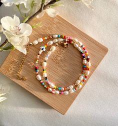 It is a handmade and colorful pearl necklace made of Miyuki and freshwater pearls. 🌸 It can be perfectly combined with simple outfits or makes a colorful statement 💌. Of course, it is also the perfect gift idea for you or your loved ones.  The necklace in pastel: https://www.etsy.com/de/listing/1163669569/handgemachte-bunte-halskette-in The bracelet looks great too! :) https://www.etsy.com/de/listing/1241794829/aruba-handgemachte-perlenarmbander-in If you want a different length, please write to me! :) DESCRIPTION: Tired of boring jewelry? Perfect - this cute & colorful necklace is a perfect eye-catcher for everyone. 💖 Choose your own clasp color and start creating your new favorite necklace! Note: If you choose "silver" as the clasp color, for example, the spacer beads will also be sil Colorful Pearl Necklace, Handmade Pearl Jewelry, Pearl Jewelry Gift, Colorful Necklace, Necklace Colorful, Summer Necklace, Colourful Necklace, Affordable Jewelry, Aruba