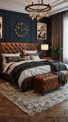 a bedroom with a large bed, chandelier and pictures hanging on the wall