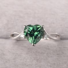 ◆ The ring is handcrafted from sterling silver and decorated with a dazzling 8*8 mm green sapphire and CZs. It is suitable for engagement/anniversary/daily occasion. ◆ Production Description: Main stone Type: Lab Green Sapphire Main Stone Shape: Heart Cut Main Stone Size: 8*8 mm(2.59ct) Side stone: CZ Metal: 925 Sterling silver - Other options available in the drop down menu ◆ Customization: √Free for Add Engraving √Other Metal Type Available √Other Gemstones & Shapes Available √Personalization Sage Green Promise Rings, Green Promise Rings For Her, Green Gem Rings, Fine Jewelry Green Heart Ring For May Birthstone, Green Heart Ring For May Birthstone, Fine Jewelry Style, Green Heart Ring For May Birthstone, Heart-shaped Green Emerald Ring For May Birthstone, Green Diamond Heart Cut Ring, Heart Shaped Green Emerald Ring For May Birthstone