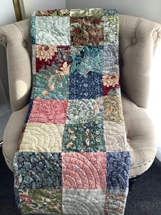 a chair with a patchwork quilt on it