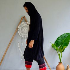 Stylish free-flow loose rayon/cotton top for festivals, travels or everyday wear. This oversized shirt can be worn as a loose casual shirt or as a nomadic festival outfit. Designed by our Moroccan friends from LA this piece truly resembles the nomad lifestyle. Try it with our glorka harem pants - they go so well together! Materials: 60% rayon/40% cotton. Very breathable. Measurements: This item is one-size and fits sizes: S, M, L, and can be worn as an oversized shirt by both men and women Care: Oversized Black Bohemian Top, Black Bohemian Tops For Festivals, Black Relaxed Fit Top For Festival, Black Oversized Tops For Festivals, Oversized Black Tops For Festival, Black Cotton Tunic Top, Black Bohemian Top For Festivals, Women Empowerment Project, Nomad Lifestyle