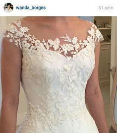 a woman in a wedding dress is looking at her selfie on instagrams