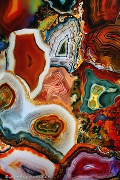 an abstract painting with many different colors and shapes on it's surface, including rocks