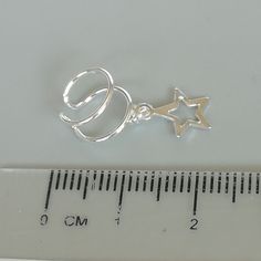 Star charm dangler, open ended sterling silver ear cuff. Dimensions: 6 x 8 mm Star: 8 x 8 Weight: .90gm Price listed is for ONE PIECE These are made of 925 hypoallergenic sterling silver. pieces come with a 925 stamp. Can be packaged in a gift box. I can include a personal message from you if needed You are welcome to contact me at... bhavnakwintra1956@gmail.com For more beautiful pieces from my shop, please browse 👇 TOE RINGS: https://www.etsy.com/your/shops/TheSilverGame/tools/listings/sectio Adjustable Silver Ear Cuff With Ear Wire, Dainty Dangle Sterling Silver Ear Cuff, Dainty Sterling Silver Dangle Ear Cuff, Silver Star-shaped Pierced Cartilage Earrings, Silver Star-shaped Cartilage Earrings With Pierced Design, Adjustable Celestial Single Cartilage Earring, Celestial Silver Cartilage Earrings, Silver Star-shaped Ear Cuff As Gift, Silver Star-shaped Ear Cuff For Gift