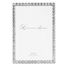 a silver frame with the word lawrencee home on it and beaded trimmings