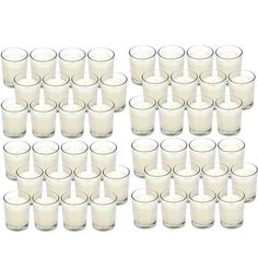 a large group of glasses filled with white liquid next to each other on a white surface