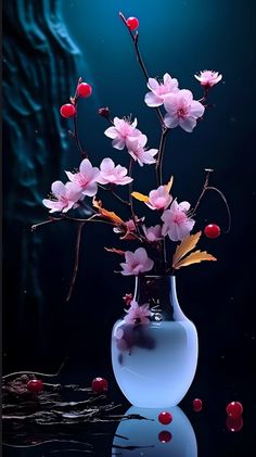 a vase filled with pink flowers on top of a table