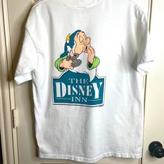 Vintage Walt Disney World “The Disney Inn” Resort Tee Shirt Back Of Shirt Has Snow White’s Sleepy Dwarf Single Stitch Size Xl Snow White Themed The Disney Inn Resort Was Open From 1986-1994 Walt Disney World, Walt Disney, Disney World, Snow White, Tee Shirt, Colorful Shirts, Tee Shirts, Mens Shirts, Man Shop