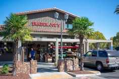 the outside of a trader's market with palm trees