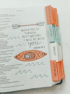 an open bible with colorful markers on it and the words when you go through deep waters i will be with you