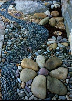 a garden path made out of rocks and stones