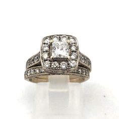 an antique style diamond ring with two rows of diamonds in the center and on the sides