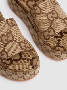 55mm Canvas covered platform. Jacquard canvas upper. All over print placement may vary. Leather lining. Canvas insole. Rubber sole Versace Brand, Ski Accessories, Loafer Mules, Print Placement, Sports Accessories, Flat Espadrilles, Swim Accessories, Heeled Loafers, Beige Brown