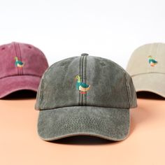 Super Cute embroidered Duck on a vintage style cap is a great addition to your everyday outfit. Great for all seasons & made in our studio in the UK. All of our caps are made to order, so you know yours are truly unique and made specifically for you by one of our team members. Our promise: - Made to order (never mass produced). Every single item is made specifically for you when you place your order. - Made in the UK. All of our items are made in our small studio in Brighton, on the south coast of England. - 100% Cotton. The caps we use are 100% cotton that has been sustainably sourced. We only work with companies and suppliers that comply with sustainable ethics guidelines. Product Type: Vintage Cap Material: 100% Cotton Design: Duck 🚚 DELIVERY 🚚 All of the orders are processed within 2 Vintage Green Dad Hat With Curved Bill, Casual Embroidered Trucker Hat With Short Brim, Casual Trucker Hat With Embroidered Short Brim, Casual Embroidered Baseball Cap With Short Brim, Retro Curved Bill Hats For Spring, Retro Cotton Dad Hat With Curved Bill, Vintage Baseball Cap For Spring, Vintage Visor Baseball Cap For Spring, Vintage Baseball Visor Cap For Spring