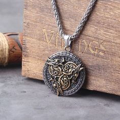 Viking Style Dragon Runes Necklace Embrace the essence of Viking heritage with our Various Dragon Runes Original Stainless Steel Material Unisex Necklace Pendant. This classic pendant, measuring 36*36mm, is designed for both men and women, making it a perfect accessory for anyone who appreciates unique jewelry. High-Quality Material Crafted from 316L stainless steel, this necklace is built to last. Key features include: Durability: Never fades, even when worn during bathing. Clasp Size: 4mm clas Viking Style Bronze Jewelry Gift, Gold Viking Style Jewelry, Gold Viking Style Necklace For Gift, Viking Style Metal Necklace For Gift, Vintage Stainless Steel Necklaces With Box Chain, Vintage Stainless Steel Box Chain Necklaces, Viking Pendant Necklace Collectible, Viking Style Pendant Necklace Collectible, Viking Style Stainless Steel Necklace For Gift