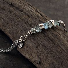 "delcate aquamarine bracelet handmade of oxidized 925 sterling silver, signed, © ewa lompe APPROXIMATE MEASUREMENTS: bracelete size: 6-8\" + 1\" charm size: 8-9 mm cut stone size: ~7-8 mm *The item pictured is not the exact ones that you will receive, but it will be the same design. The matching earrings are here: https://www.etsy.com/listing/692739263/aquamarine-earrings-sterling-silver?ref=shop_home_active_2&pro=1 and here: https://www.etsy.com/listing/776874179/light-blue-aquamarine-earri Oxidized Silver Bracelet, Multi Chain Bracelet, Aquamarine Bracelet, Metalsmithing Jewelry, Bohemian Jewellery, Artisan Bracelets, Aquamarine Earrings, Bracelet Sterling Silver, Birthday Gift For Her