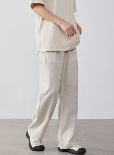 Embrace relaxed sophistication with our Linen High-Waisted Wide-Leg Trousers, perfect for any casual or smart-casual rendezvous.
Expertly tailored from a refreshing blend of linen and cotton, these trousers offer a breathable and comfortable fit, ideal for warmer days. A practical, elastic waist ensures a snug fit, while the loose straight cut and solid color design lend a touch of nonchalant elegance.
Pair them with a fitted tee or button-up shirt for a smart look, or throw on an oversized swea Straight Linen Pants For Business Casual, Linen Dress Pants With Pockets, Ankle-length, Linen Ankle-length Dress Pants With Pockets, Business Casual Linen Straight Pants, Ankle-length Linen Dress Pants With Pockets, Versatile Beige Linen Wide Leg Pants, Classic Linen Wide Leg Pants For Business Casual, Solid Linen Pants For Workwear, Versatile Beige Linen Pants