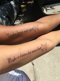 two people with matching tattoos on their arms saying together forever and maybe in distance but never in sight