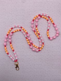 Beautiful and fun lanyard inspired by a Peach Ring. The oranges and pinks make such a cute combination and such a fun design. Sturdy and durable. Lanyards are made to order and shipped in a timely manner. Customizations available for an extra cost. Whether you're buying one for yourself or as a gift, this gorgeous design is sure to spice up any outfit! Pink Beaded Lanyard, Fun Adjustable Lanyards, White Adjustable Fun Lanyards, Peach Ring, Pink Lanyard, Adjustable Personalized Pink Lanyard, Cute Lanyard, Lanyard Teacher, Cute Lanyards