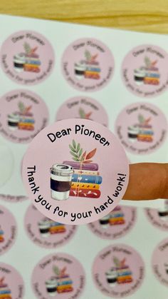 a person holding up a sticker that says dear phoner thank you for your hard work