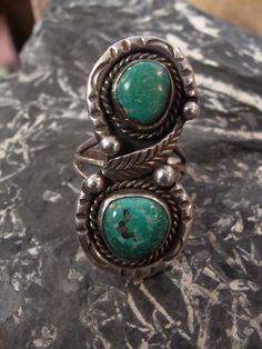 Here is a beautiful vintage turquoise ring. It is a size 6.5. The top of the ring measures slightly over 1 5/8 inch north and south and 3/4 in at the widest point. The turquoise is beautiful and its a heavy ring...weighing 10.2 grams. It is not hallmarked but has been tested to be sterling silver. A wonderful ring with classic style and a gorgeous piece of turquoise...a nice addition to any collection. And of course...free shipping. Vintage Round Turquoise Ring, Vintage Turquoise Round Ring, Antique Turquoise Ring With Patina, Vintage Turquoise Ring, Seed Pearl Ring, Silver Opal Ring, Native American Rings, Native Jewelry, Mystic Topaz