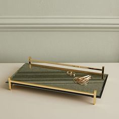 a tray with a ring on it sitting on a table