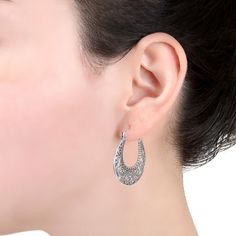 Add a touch of vintage-inspired elegance to your jewelry collection with these sterling silver filigree hoop earrings.Click on this JEWELRY & WATCHES GUIDE to learn about fit, styles, materials and more! FEATURES Diameter: 28 mm Backings: click-it Nickel free Metal: sterling silver Finish: oxidized, polished, textured Size: One Size. Color: White. Gender: female. Age Group: adult. Silver Filigree Small Hoop Jewelry, Sterling Silver Filigree Hoop Jewelry, Anniversary Jewelry With Intricate Design, Silver Sterling Silver Hoop Earrings With Filigree, Elegant Sterling Silver Filigree Hoop Earrings, Elegant Oxidized Hoop Earrings For Wedding, Small Hoop Sterling Silver Filigree Earrings, Small Sterling Silver Filigree Hoop Earrings, Elegant Round Hoop Earrings With Oxidized Finish