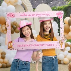 two girls holding up a pink sign with the words martina's cowboy party