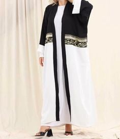 Open long Arabic calligraphy kaftan. Beautiful flowing soft fabric. Free size. White Long Abaya For The Beach, White Long Abaya For Beach, Elegant Long Kimono For Eid, Elegant Long Sleeve Thobe For Beach, Elegant Long Thobe For Beach, Elegant White Thobe For Beach, Elegant White Kimono For Eid, Elegant White Maxi Length Kimono, Elegant White Maxi Dress With Kimono Sleeves