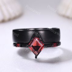 Natural Red Garnet Couple Ring Black Gold Matching Ring Set His and Hers Wedding Band Lozenge Cut Promise Ring For Men For Women Bridal Gift Men's ring: 5mm band width Women's ring: 7x9mm lozenge cut and 3x1.5mm baguette cut natural red garnet 1.2mm band width More style ring you can find in our shop: www.etsy.com/shop/PENNIjewel --------------------------------------- Size: US3-11 (If your ring size is lower than 3 or larger than 11,please contact me firstly. I will custom make this ring size for you.) ---------------------------------------------- Craft Period: All our items are handmade, pls allow me 2-3weeks to finish. Rush finish and rush delivery service are also available if you pay extra fee. When you need it, pls email me directly. Rush finishing listing:  www.etsy.com/listing/465 Elegant Black Ruby Ring, Formal Black Rings With Ruby, Black Round Ruby Ring, Black Ruby Anniversary Ring, Round Black Ruby Ring, Black Ruby Wedding Jewelry, Black Ruby Jewelry For Wedding, Wedding Black Ruby Jewelry, Black Ruby Ring For Anniversary