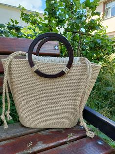 a purse sitting on top of a wooden bench