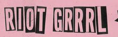 a pink wall with black and white lettering on it that says riot grrrll