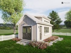 a small shed sitting on top of a lush green field