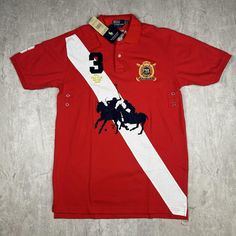 Showcase your sporty side with this Vintage Polo Ralph Lauren Mercer Team #3 Polo Club Shirt in Men's Size 2XL. This iconic piece features the classic Polo Ralph Lauren design, complete with embroidered team patches and the signature number 3 on the sleeve. Crafted for both comfort and style, this polo shirt embodies a timeless preppy look, perfect for any casual or semi-formal occasion. Please refer to the provided pictures for a detailed view of the condition and measurements of this item. We strive to present our pieces as accurately as possible, ensuring you have a clear understanding of their fit and wear. We put in our best efforts to clean and remove any stains, marks, etc. from our vintage pieces, but due to the nature of these items, some imperfections may remain. If you have any Fitted Crew Neck Polo Shirt For Sports, Fitted Sporty Polo Shirt For Sports Events, Casual Team-colored Polo Shirt With Graphic Print, Casual Short Sleeve Polo Shirt With Three Stripes Branding, Sporty Team-colored Short Sleeve Polo Shirt, Casual Short Sleeve Polo Shirt With Three Stripes, Fitted Crew Neck Polo Shirt For Sports Events, Fitted Red Polo Shirt For Sports, Cotton Moisture-wicking Polo Shirt For Sports Season