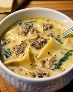 a close up of a bowl of soup on a table