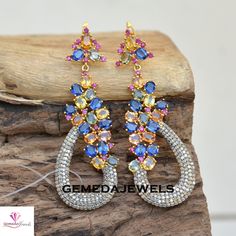 Genuine Multi Gemstone Earrings, Pave Diamond Jewelry, Diamond Dangle Earrings, 925 Silver Gemstone Jewelry, Gold Plated Earrings, Gift Gross Weight: 21.90 gm Diamond Weight: 2.73 Cts Gemstone Weight: 17.74 Cts Earings Size: 70X23 MM NOTE:- All The Products Are Designed And Manufactured In My Workshop By Me & My Team. Shown Products Are Purely Handmade. Custom Orders Are Open Handly Accepted. We Are the Perfect Choice For Any Custom Jewelry Manufacturing. For Bulk Orders Please Message me. Visit Multicolor Sterling Silver Earrings For Party, Multicolor Sterling Silver Party Earrings, Party Multicolor Sterling Silver Earrings, Sterling Silver Dangle Earrings With Stones, Multi-stone Cubic Zirconia Earrings For Anniversary, Fine Jewelry Multi-stone Dangle Earrings, Sterling Silver Multi-stone Earrings Fine Jewelry, Sterling Silver Multi-stone Teardrop Earrings, Sterling Silver Earrings With Stones For Anniversary