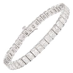 Stunning modern straight radiant cut natural diamond tennis bracelet. High jewelry by Alexander Beverly Hills. 43 radiant cut diamonds, 21.80 carats. Approximately E/F color and VS clarity. 18k white gold, 26.40 grams, 7 inches. Accommodated with an up to date appraisal by a GIA G.G., please contact us with any questions. Thank you. Item Number 0078 Luxury Rectangular Brilliant Cut Diamond Bracelet, Luxury Rectangular Diamond Cut Bracelet, Luxury Rectangular Diamond Cut Tennis Bracelet, Formal Rectangular Diamond Tennis Bracelet, Diamond Tennis Bracelet For Wedding, Classic Brilliant Cut Diamond Bracelet, Classic Rectangular Brilliant Cut Diamond Bracelet, Classic Rectangular Diamond Bracelet With Brilliant Cut, Rectangular Diamond Cut Wedding Bracelet