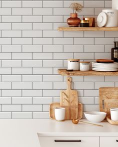 the kitchen counter is clean and ready to be used for cooking or baking, with white subway tiles on the wall behind it