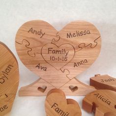 personalized wooden puzzles with names and date in heart shape on white tablecloth