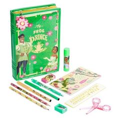 the frog prince book and stationery set includes pens, pencils, markers, and an eraser