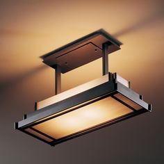 a square light fixture hanging from the ceiling