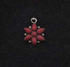 "Nice vintage sterling silver pendant with a snowflake-like form, decorated with red enameling.  11/16 x 1/2\" 1.3g Marked \"925\"" Red Flower Charm Pendant Jewelry, Red Pendant Jewelry With Flower Charm, Red Flower Pendant Jewelry With Charm, Red Flower Pendant Jewelry With Flower Charm, Red Round Jewelry With Flower Charm, Red Pendant Jewelry With Charms, Red Sterling Silver Flower-shaped Jewelry, Red Flower Shaped Sterling Silver Jewelry, Red Sterling Silver Jewelry In Flower Shape